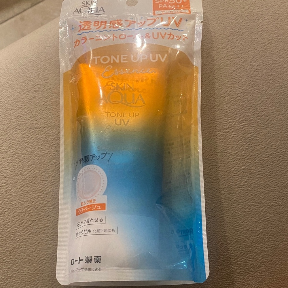 Skin Aqua Tone Up UV Essence Suncare - Blue and Orange.  Made in japan